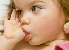 baby girl sucking her thumb